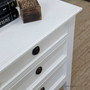 Detailed shot showcasing the smooth satin-white finish on the bedside top surface.