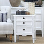 Three-quarter view of the Peninsula white bedside styled with soft, coastal-inspired décor.
