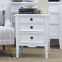 Side-perspective shot displaying the clean lines and bright finish of the Peninsula white bedside.