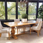 Angled perspective of the dining table, emphasizing the smooth yet rustic parquetry top and the table's versatility in decor styles