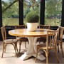 View of the Artisan Parquetry Top Round Dining Table at Canalside Interiors, showcasing its recycled timber and elegant parquetry top.