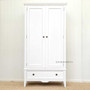 In a minimalist lounge room, the wardrobe adds character and essential storage, blending seamlessly with the decor.