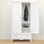 Perspective shot emphasizing the wardrobe's tall and elegant silhouette, making it a statement piece for any room."