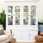 The Key Largo 4 Door Display Unit in distressed white offers a coastal charm, perfect for a Hamptons-inspired living room – Canalside Interiors