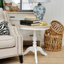 Styled in a living room setting, the side table complements both modern and classical decor.