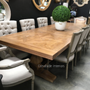 View of the Artisan Parquetry Top Dining Table at Canalside Interiors, showcasing its recycled timber and hand-carved pedestal base.