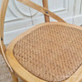 Hamptons chic is redefined with the Natural Oak Cross Back Chair, a symbol of refined taste and elegance