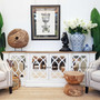 Front view of the Marielle Mirrored Sideboard in stone with heavy distressing and a weathered oak top, showcasing its unique circular overlay pattern on aged mirrored doors.