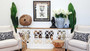 Decor vignette atop the Marielle Mirrored Sideboard, illustrating how its surface can be adorned with decorative items and personal treasures.