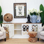 View of the Marielle Sideboard, emphasizing its stepped front design and the depth of its weathered oak top.
