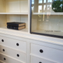 Detail of the practical drawers in the base, offering hidden storage solutions for a clutter-free space.