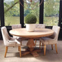 Front view of the Artisan Round Dining Table at Canalside Interiors, displaying its recycled timber craftsmanship and hand-carved pedestal base.