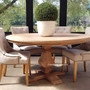 Front view of the Artisan Round Dining Table at Canalside Interiors, displaying its recycled timber craftsmanship and hand-carved pedestal base.