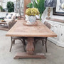 The Rustic Artisan Parquetry Dining Table in a lively family room, serving as the heart of the home for gatherings.