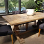 The Rustic Artisan Parquetry Dining Table in a lively family room, serving as the heart of the home for gatherings.