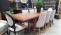 The Lavinia Extendable Table showcases a sophisticated dark hue, ideal for timeless coastal dining settings - Canalside Interiors