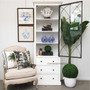 The cabinet set against a coastal-themed backdrop, proving its versatility in blending with both classical and Hamptons-style interiors.