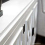 Sideboard detail showing minor distressing on white Ellery, offering a coastal vibe in dining room storage - Canalside Interiors
