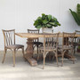 The Botanica Chair amidst a coastal Hamptons setting, showcasing its ability to complement both indoor and outdoor dining environments.