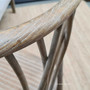 Detail shot of the chair's textured finish, emphasizing the beauty and quality of the oak timber and its easy-to-clean surface.