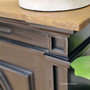 Detailed shot of the sideboard's distressed charcoal/black finish, emphasizing the artisanal craftsmanship and unique character of each piece.