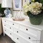Close-up of the sideboard's intricate detailing, highlighting the traditional craftsmanship and understated charm.