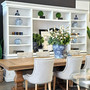 Style shot of the  Casement TV Media Wall Unit in white in a dining setting, showing its timeless appeal