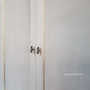 Close-up of the wardrobe's stone rattan work, highlighting the exceptional craftsmanship and texture.