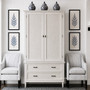 Front on view of the Brielle Rattan Wardrobe Cupboard in situ at Canalside Interiors, showcasing its distressed stone finish and stone rattan detailing.