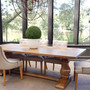 Elegant dining setup featuring the Hampton Bay Table, illustrating its spacious design and suitability for large family gatherings and sophisticated entertaining.