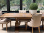 Positioned in a contemporary open-plan living space, the table seamlessly integrates dining and living areas.