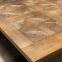 Close-up of the hand-crafted parquetry top, highlighting the meticulous detail and textural yet smooth finish.