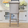 View on the exquisite button detailing, brass studding and cream fabric, offering a closer look at the texture and quality that make this stool a must-have for modern, quality-conscious interiors.