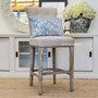 Montague Bar Stools in a bright, airy space, showcasing their role in creating inviting dining areas that merge functionality with aesthetic appeal in coastal and Hamptons-inspired homes.
