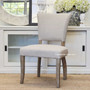 The Mimi Dining Chair set in a living room exemplifying how it complements both contemporary and classical dining room decors.