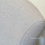 Angled view emphasizing the chair's cream upholstery, perfect for adding a touch of timeless quality to modern interiors.