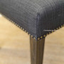timeless in design, the Leclerc Dining Chair with its black/charcoal finish and stud details, resonates with the quality of Canalside Interiors