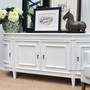 Showcase the elegant, curved lines of Canalside Interiors' Francia Sideboard in distressed white, an epitome of Hamptons style for a sophisticated bedroom