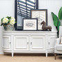 This Francia Curved 212cm Sideboard in distressed white from Canalside Interiors offers a seamless blend of Hamptons grace and modern functionality for your bedroom.