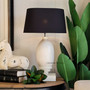 Imbue your bedroom with the classical charm of the Clemence Lamp from Canalside Interiors. Its luxurious black finish and quality construction make it a versatile choice.