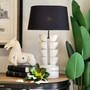 View of the handcrafted timber Ambroise Lamp from Canalside Interiors, highlighting its unique natural and recycled timber charm.