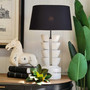 View capturing the Ambroise Lamp's handcrafted beauty, ideal for adding a touch of rustic charm to sophisticated spaces.