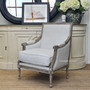 In-situ view of the armchair in a coastal-themed lounge room, enhancing the space with its timeless design.