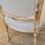 Embodying sophistication, the Knightley Dining Chair from Canalside Interiors enhances any living room with its timeless design and limewash finish