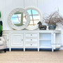 Adorn your bedroom with the Francia Grande Sideboard from Canalside Interiors; its distressed white hue and French curves adding a layer of coastal elegance.