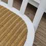 View of the Botanica Dining Chair from above, focusing on the intricate weave of the natural rattan seat