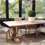 Angled rear view of the Artisan Dining Table, emphasizing the table's capacity to complement a variety of gathering space