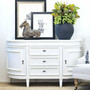 The Francia Petite Curved Sideboard in distressed white, a Canalside Interiors piece blending Hamptons luxury with modern living room design