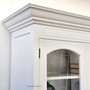 Crafted for elegance, the Key Largo Display Unit's white finish and classical lines enhance the storage appeal in a living room