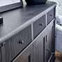 The distressed black finish of the French Louis Buffet Grande, offering timeless storage for living room essentials in Sydney's stylish interiors.